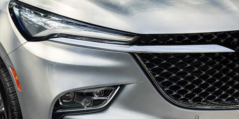 Close-up of the 2022 Buick Enclave’s LED headlights illuminated