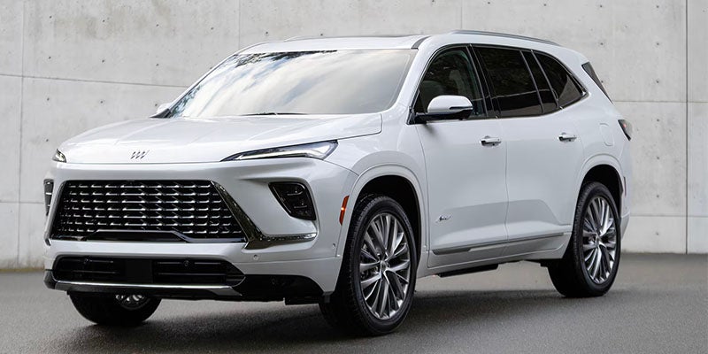 Enclave Vehicle Parked In Front Of A Wall