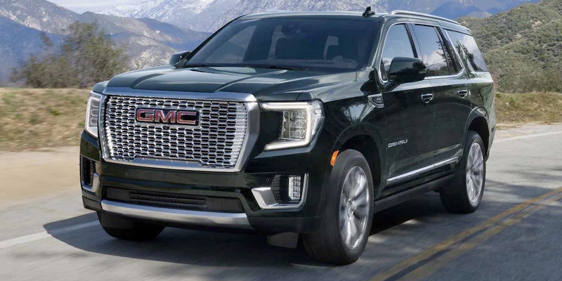 2022 GMC Yukon parked at a scenic mountain overlook