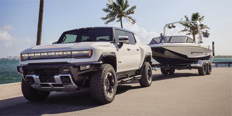 Hummer EV Vehicle Towing A Boat