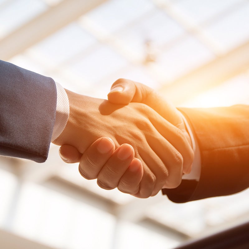 Dublin Buick GMC in Dublin CA customer shaking hands with sales rep