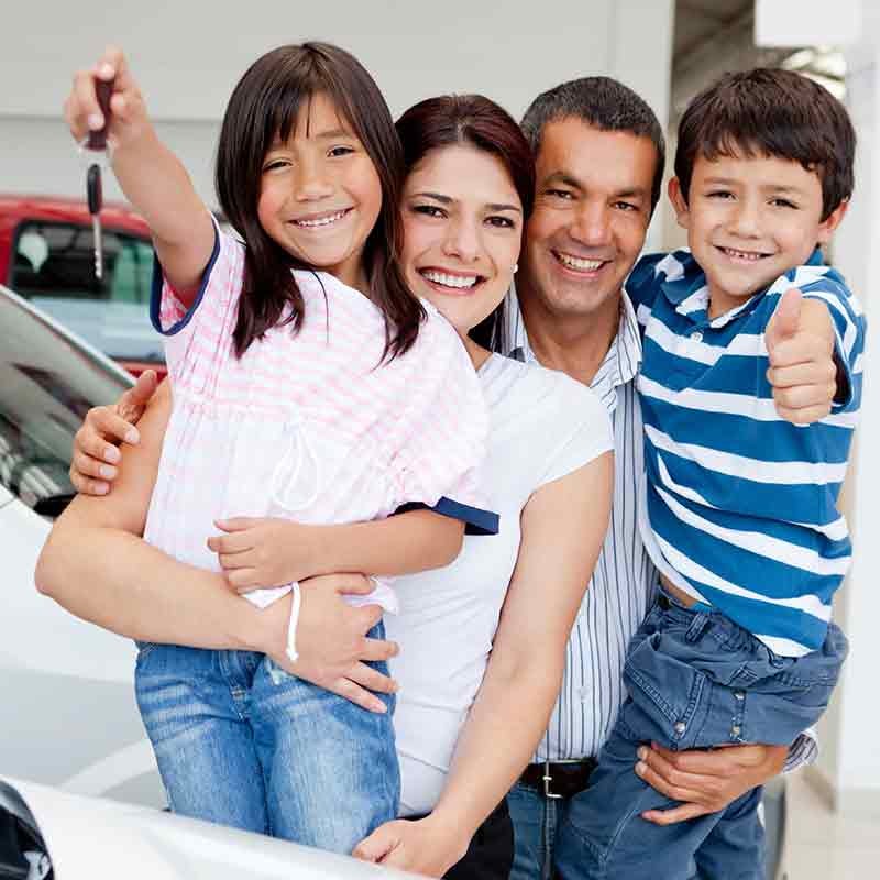 Dublin Buick GMC in Dublin CA family holding keys to their new used car