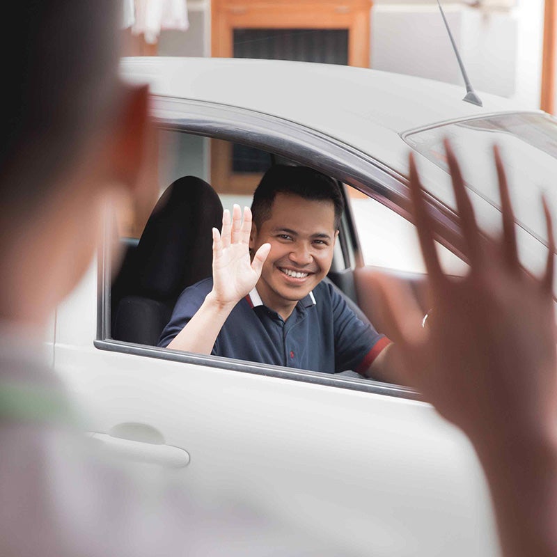 Dublin Buick GMC in Dublin CA sales rep waving at customer
