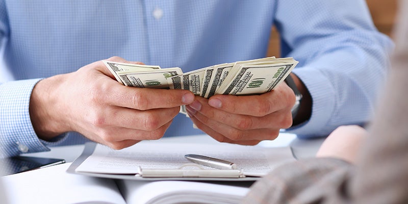 Dublin Buick GMC in Dublin CA customer holding cash