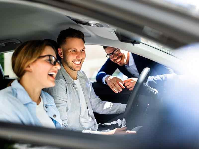 Dublin Buick GMC in Dublin CA couple sitting in loaner vehicle