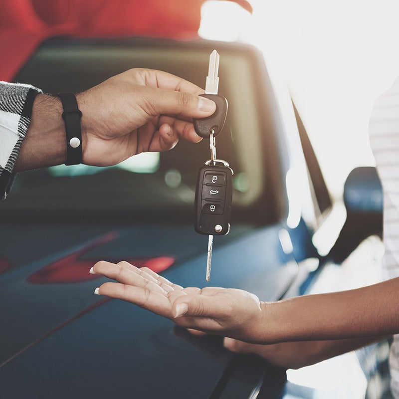 Dublin Buick GMC in Dublin CA sales rep handing over car keys