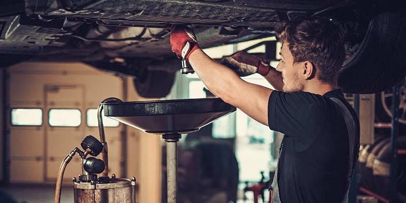 Dublin Buick GMC in Dublin CA technician working under car