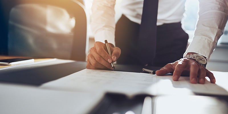 Dublin Buick GMC in Dublin CA customer signing paperwork