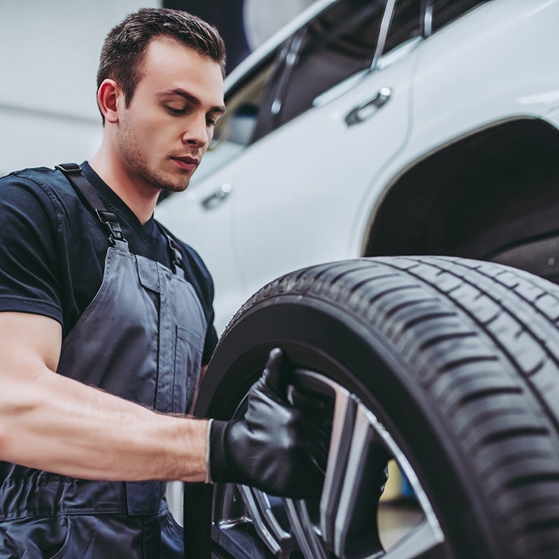 Dublin Buick GMC in Dublin CA technician replacing tire